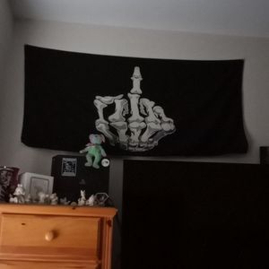 Skeletal hand middle finger wall flag